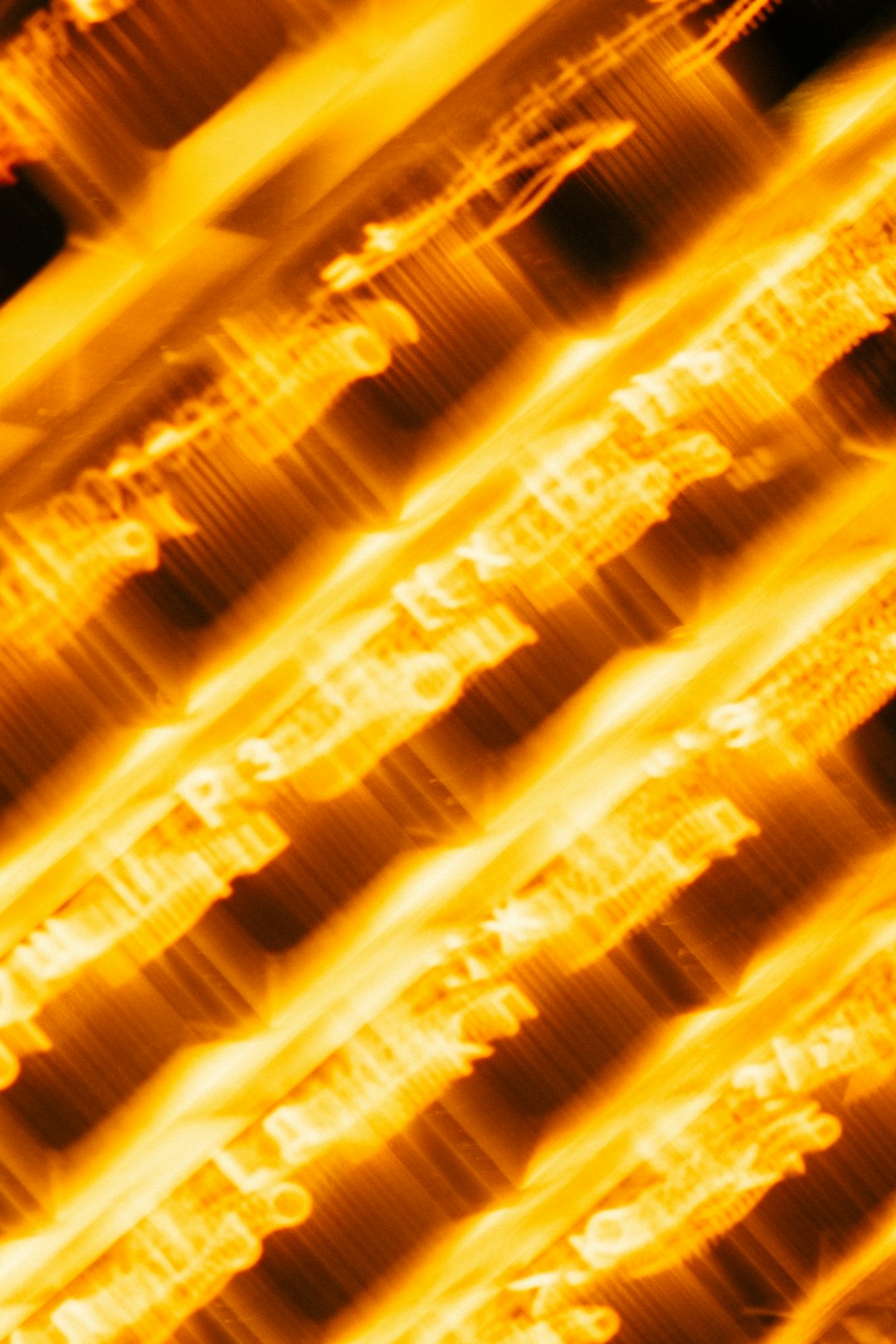 a-blurry-image-of-a-yellow-fire-hydrant-q-flabb3pne