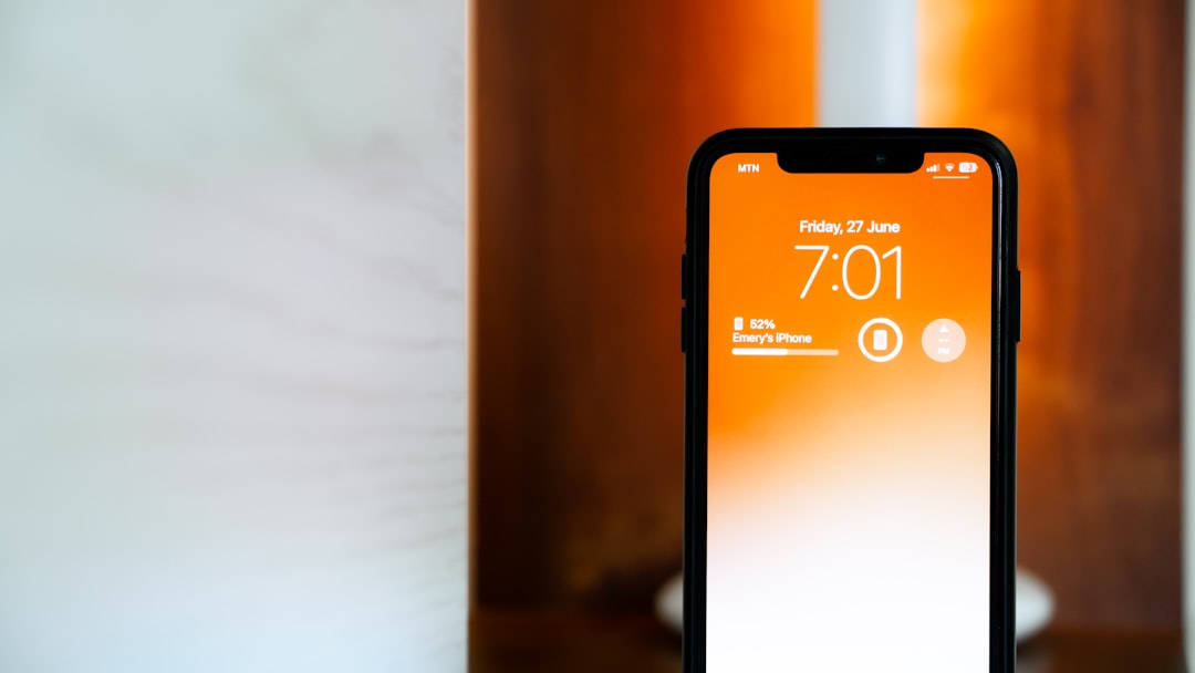 a-phone-displays-the-time-screen-lit-orange-vqewkweuysi